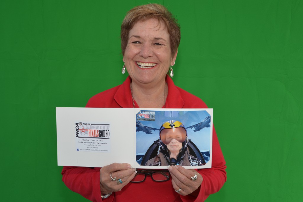 Deb Hall, Western Pacific Roofing, getting her souvenir photo at the CA Finals Booth at the LA County Airshow 