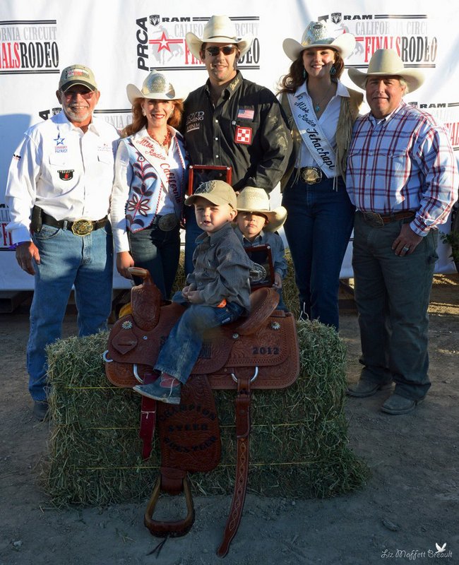 Mackenzie and Year End Champion Steer Wrestler Luke Branquinho (photo by Liz Breault) 