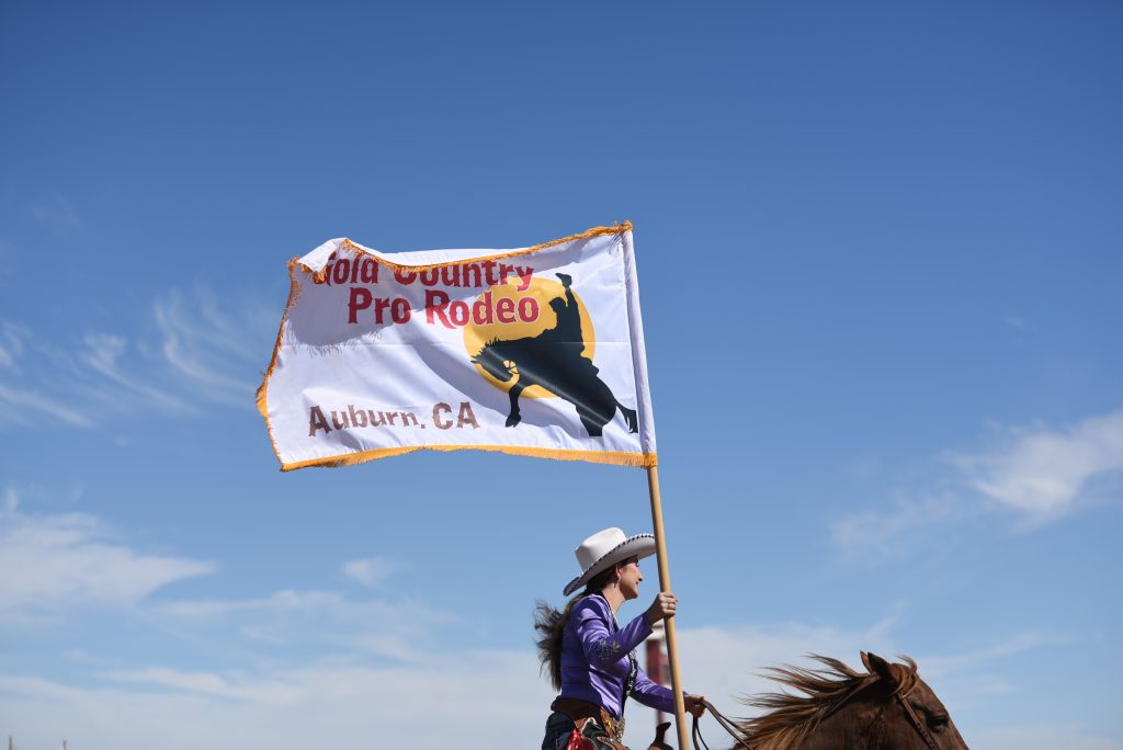 2016 Gold Country Pro Rodeo Queen, Sydney Frank, presenting her rodeo's flag at the 2016 RAM PRCA California Circuit Finals Rodeo