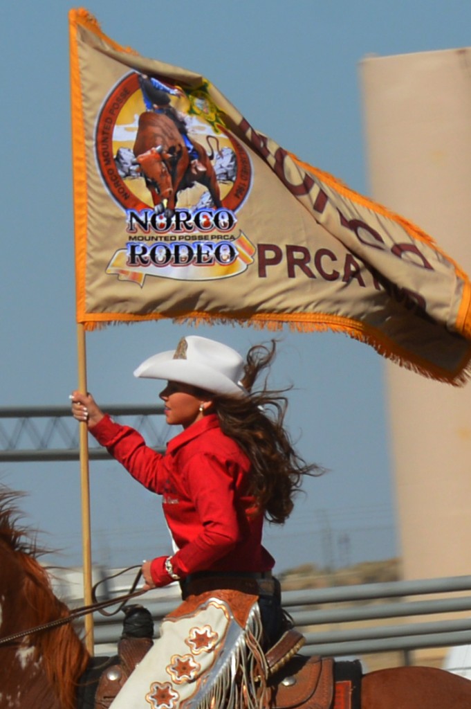 Kristyann Miller, Miss Norco Mounted Posse PRCA Rodeo Queen 2014 - presenting her rodeo's flag at the 2014 RAM PRCA California Circuit Finals Rodeo